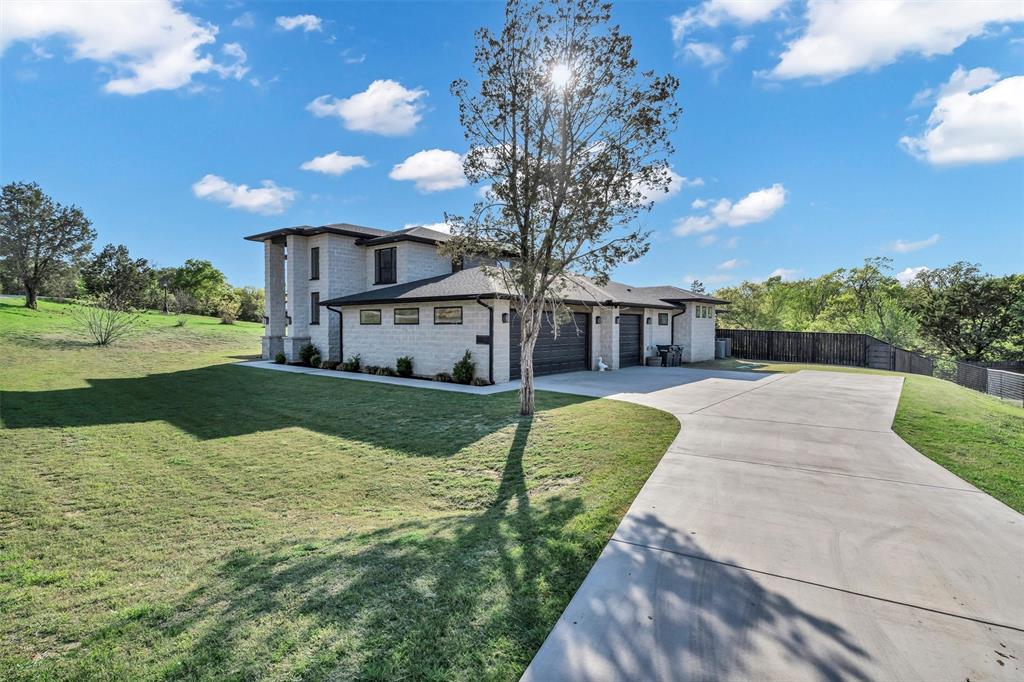 175 Bittersweet Trail Weatherford, TX 76088 - Photo 35 of 40 a view of a house with a yard