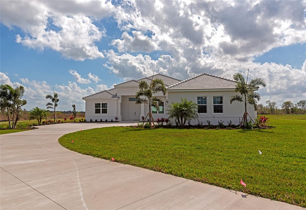 3498 Quiver Circle Sarasota, FL 34240 - Photo 1 of 1 a front view of a house with garden