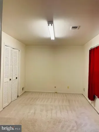 an empty room with wooden floor
