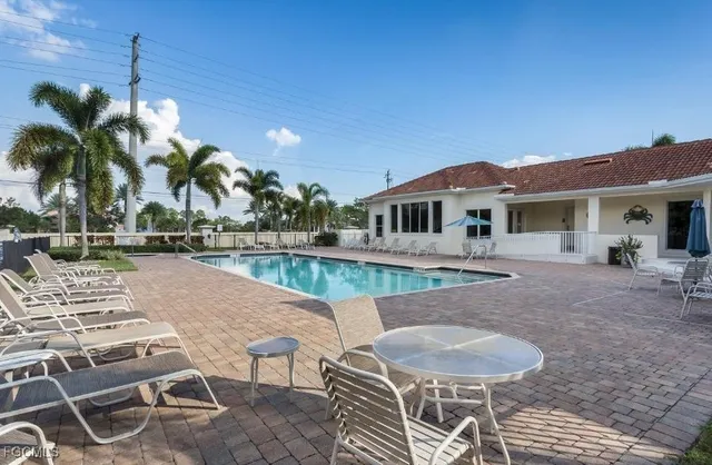 a view of a patio with swimming pool