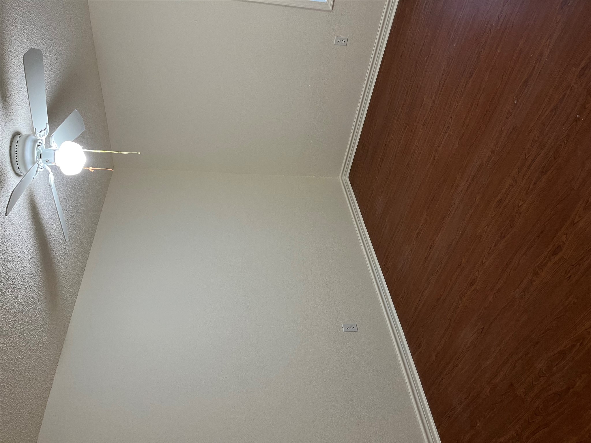 23393 Nameless Road, Unit 144 Leander, TX 78641 - Photo 18 of 23 Unfurnished room featuring a textured ceiling, ceiling fan, baseboards, and dark wood-style flooring