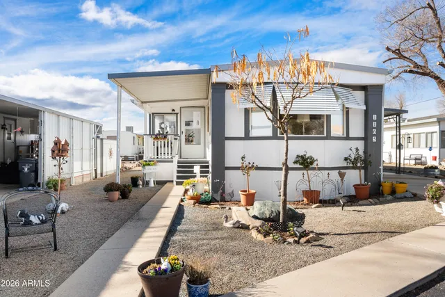 a view of a living room and chandelier