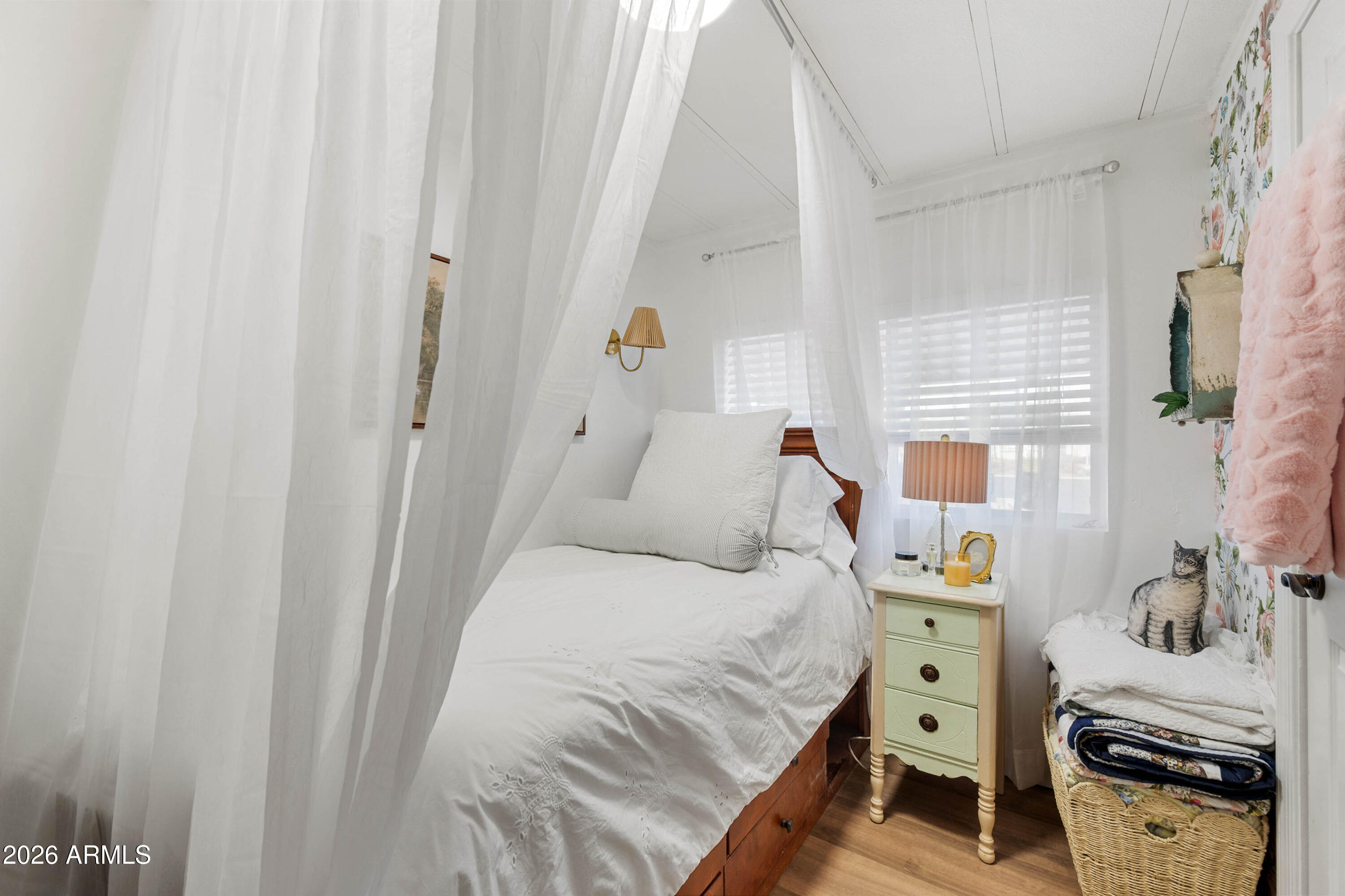 1165 Rocking M Lane, Unit 1165 Prescott Valley, AZ 86327 - Photo 13 of 30 a bedroom with a bed and a window