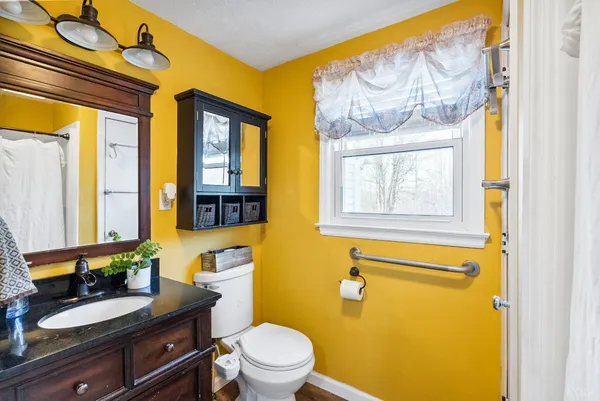 a front view of a house with swimming pool and porch