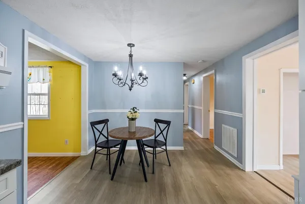 a bathroom with a granite countertop sink mirror vanity and toilet