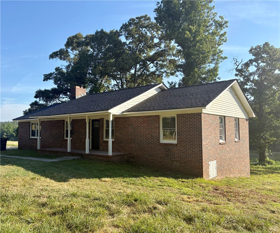 351 Randys Road Westminster, SC 29693 - Photo 2 of 30 A classic brick home with a welcoming covered front porch, offering timeless appeal.