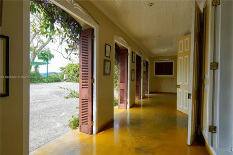 a view of a hallway with a outdoor space