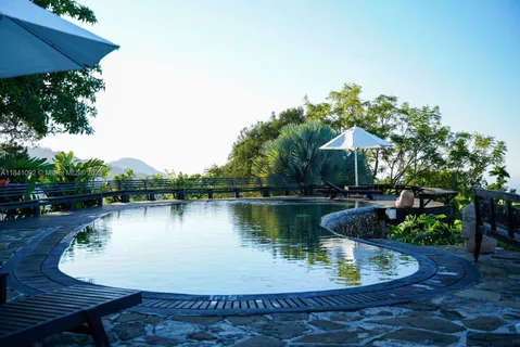 a view of a backyard with sitting area