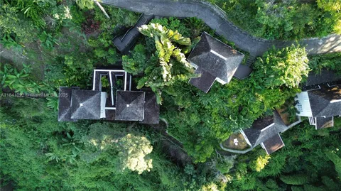 an aerial view of a house with a garden