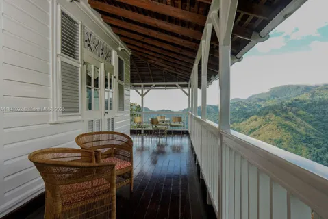 a view of balcony with furniture