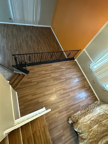 a view of outdoor space with wooden floor