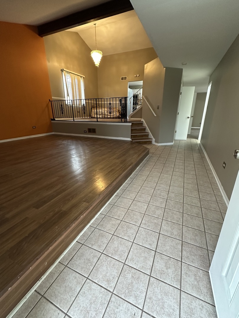 16627 Carse Avenue Harvey, IL 60426 - Photo 14 of 23 a view of entryway and hall with wooden floor