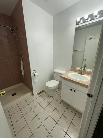 a view of a livingroom with a furniture chandelier fan and windows