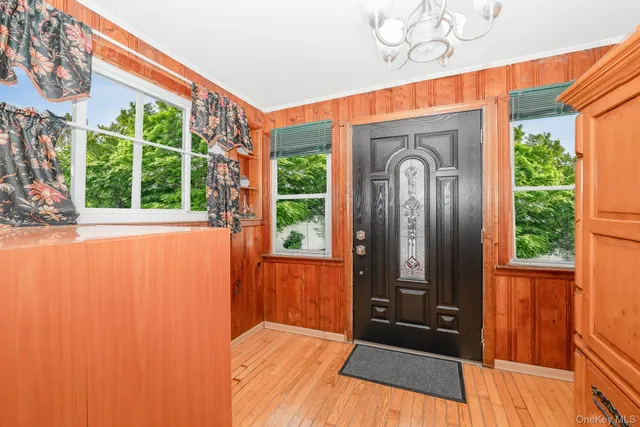 a view of front door with a potted plant