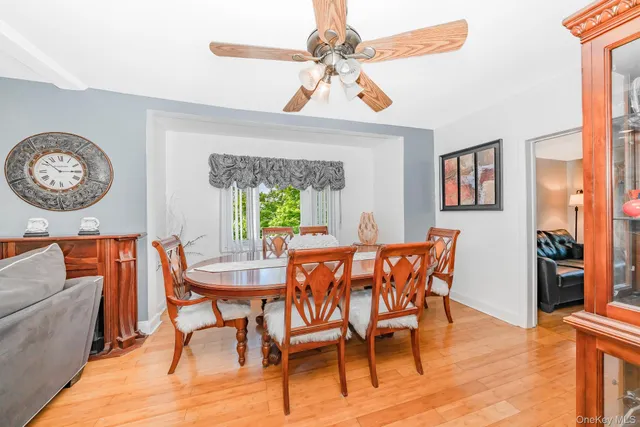 a dining room with furniture a rug and a chandelier