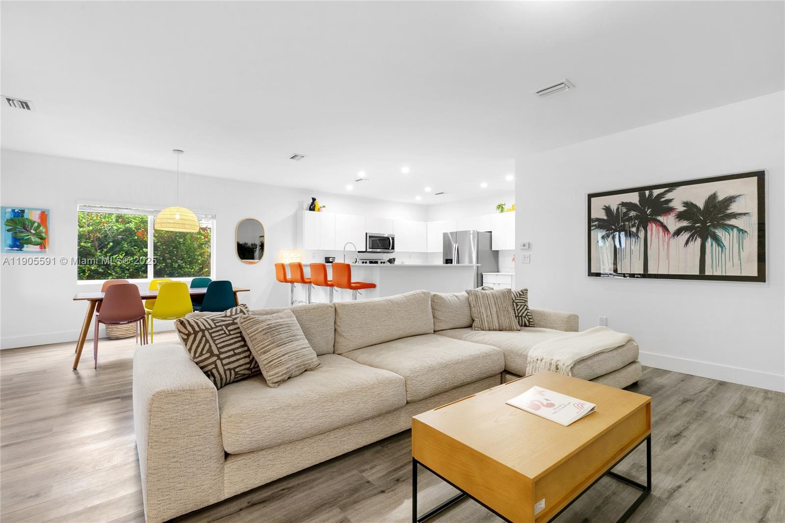 1123 Northeast 23rd Terrace Pompano Beach, FL 33062 - Photo 12 of 35 a living room with furniture and a large window