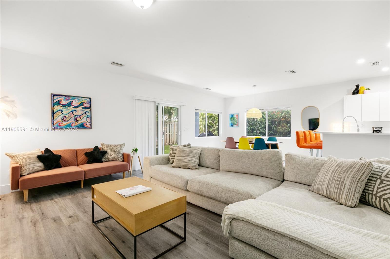 1123 Northeast 23rd Terrace Pompano Beach, FL 33062 - Photo 13 of 35 a living room with furniture and a large window