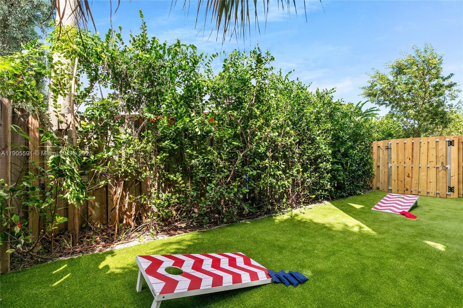 1123 Northeast 23rd Terrace Pompano Beach, FL 33062 - Photo 26 of 35 a view of an outdoor space with a garden