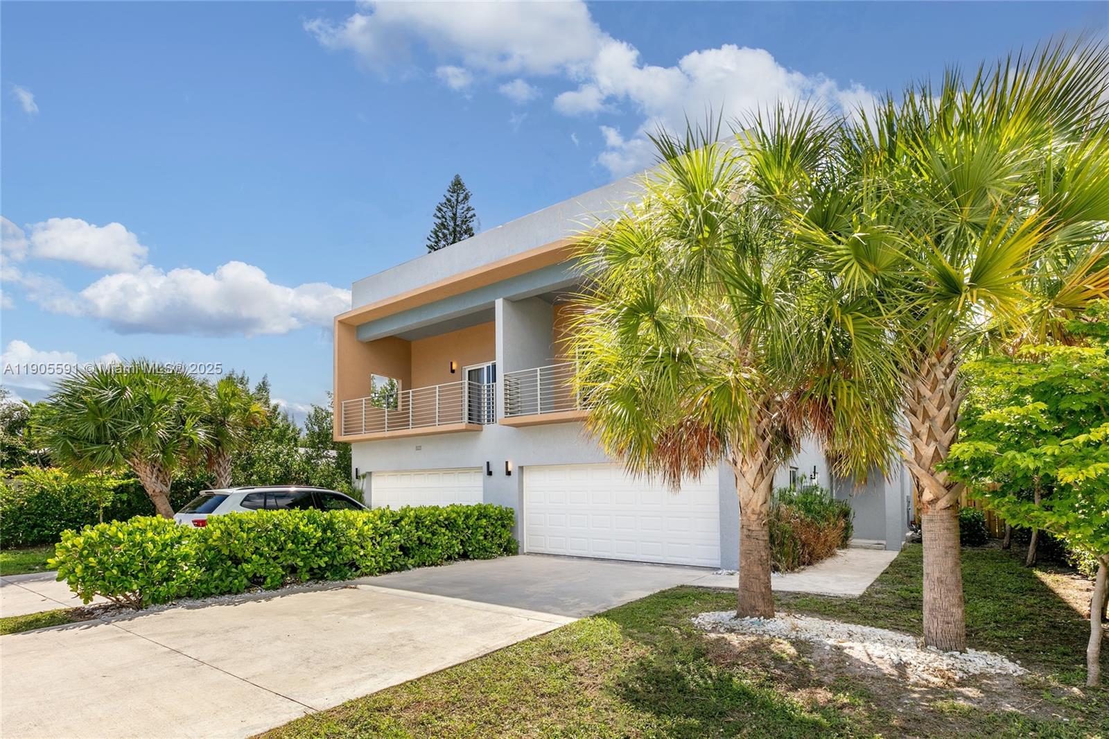 1123 Northeast 23rd Terrace Pompano Beach, FL 33062 - Photo 3 of 35 a front view of a house with garden