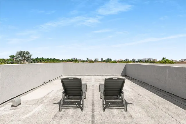 a view of a chairs and table in the terrace