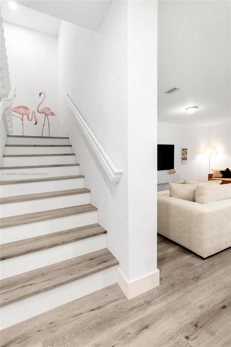 1123 Northeast 23rd Terrace Pompano Beach, FL 33062 - Photo 32 of 35 a view of entryway and hall with wooden floor