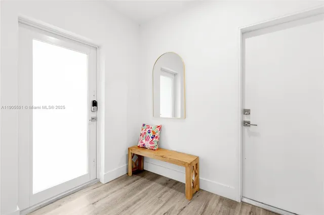 a bath room with a table and a window
