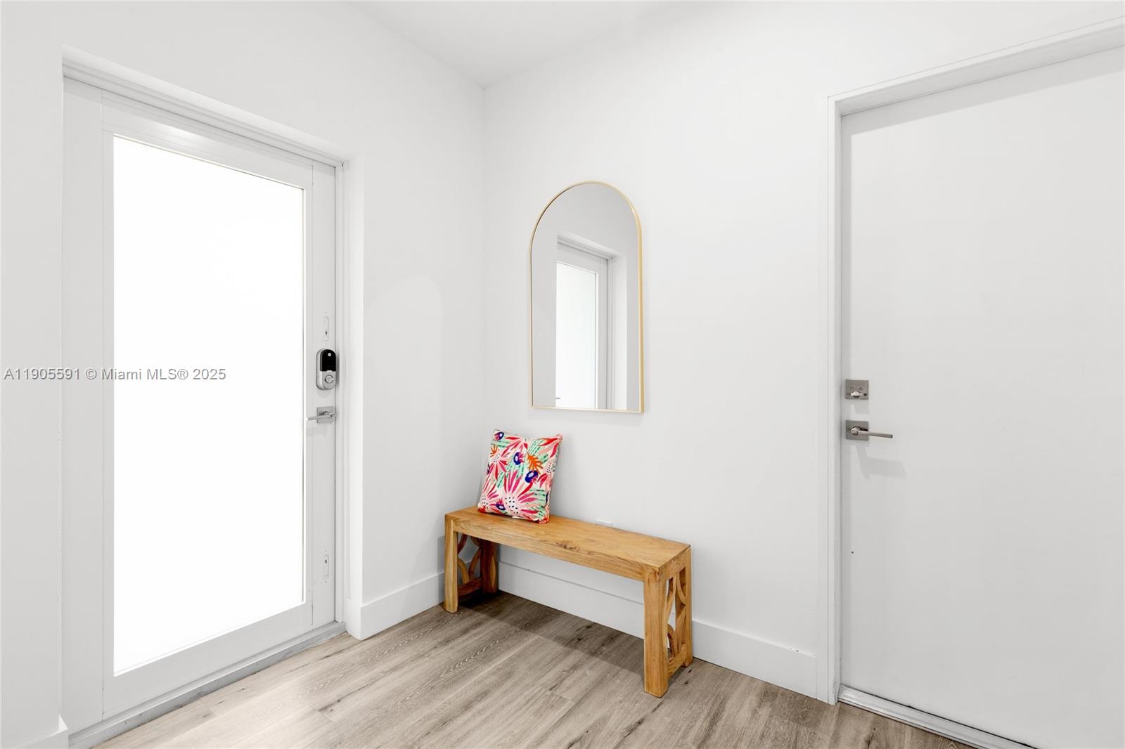 1123 Northeast 23rd Terrace Pompano Beach, FL 33062 - Photo 4 of 35 a bath room with a table and a window