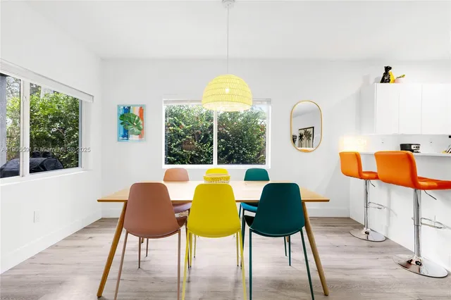 a balcony with table and chairs