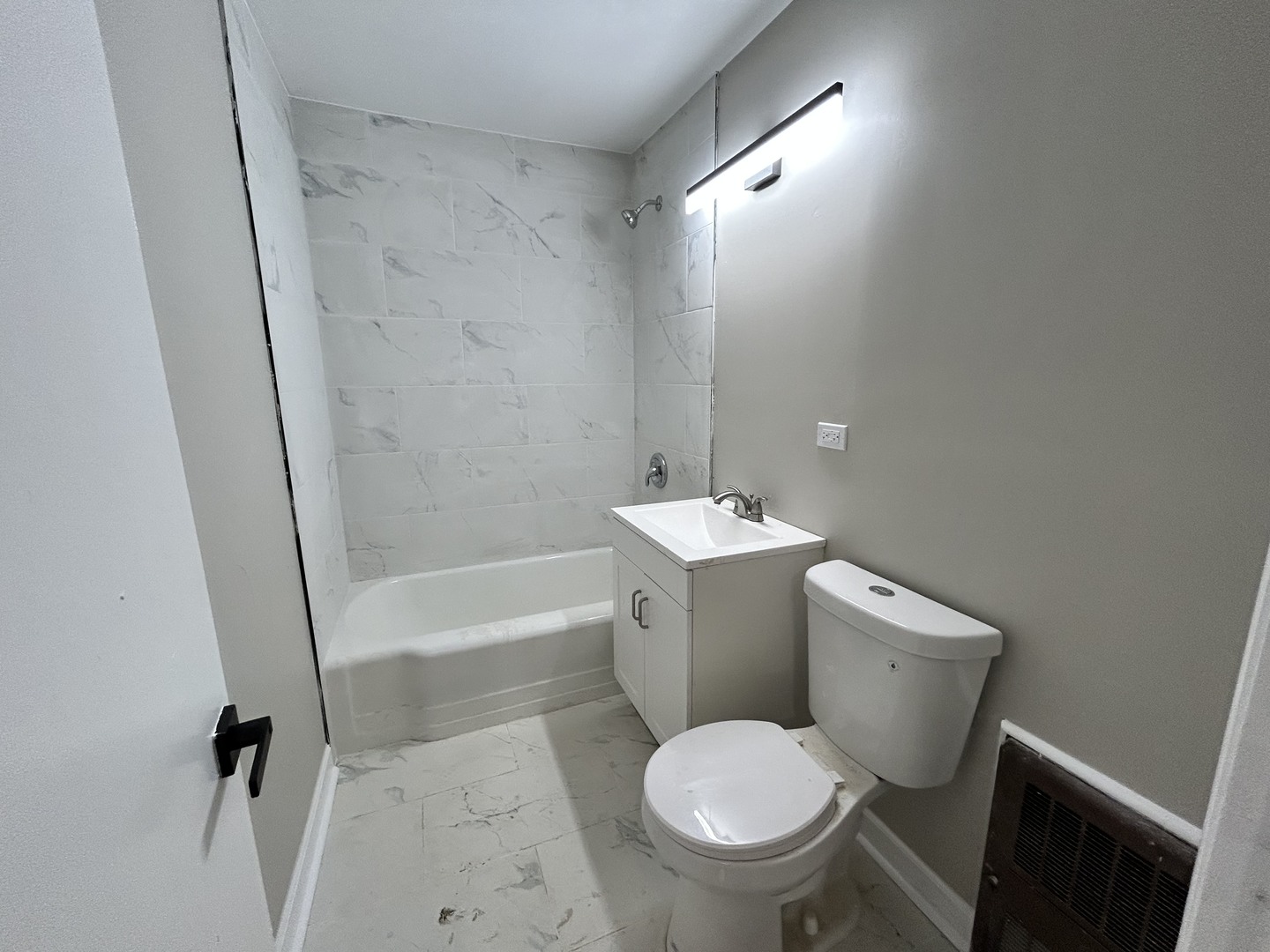 16155 Honore Avenue Markham, IL 60428 - Photo 4 of 5 a bathroom with a toilet sink and shower
