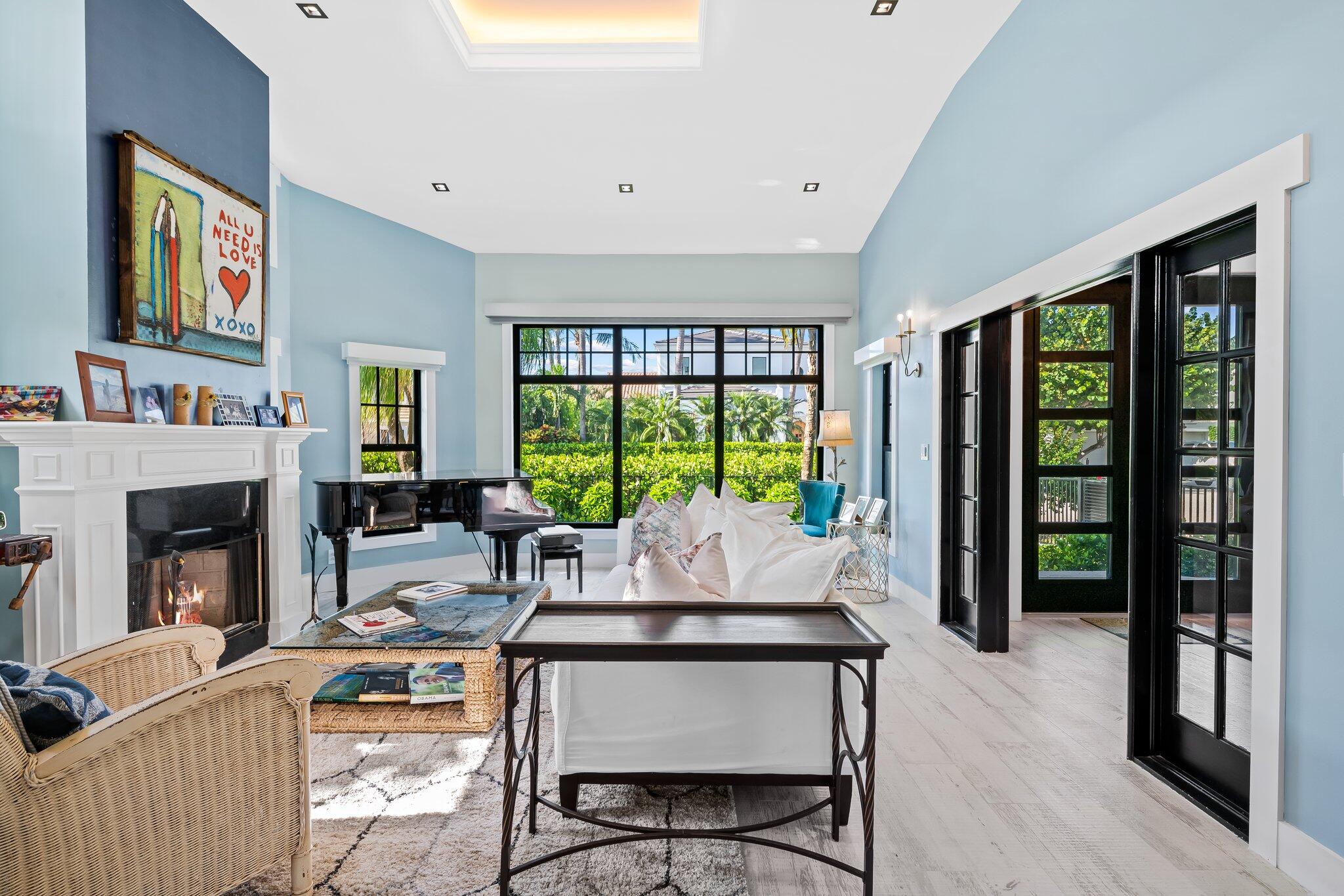 38 Hersey Drive Ocean Ridge, FL 33435 - Photo 11 of 33 a living room with fireplace furniture and a large window