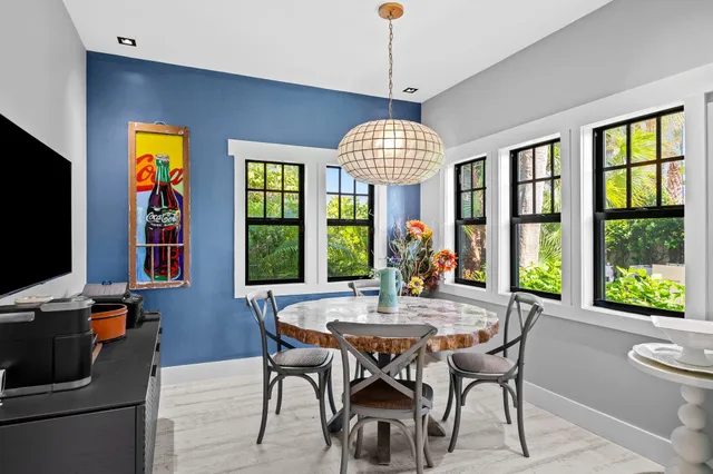 a view of a dining room with furniture window and outside view