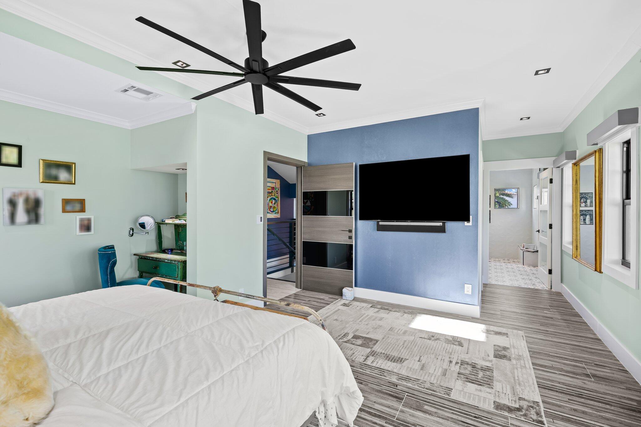 38 Hersey Drive Ocean Ridge, FL 33435 - Photo 22 of 33 a bedroom with a bed and a flat screen tv