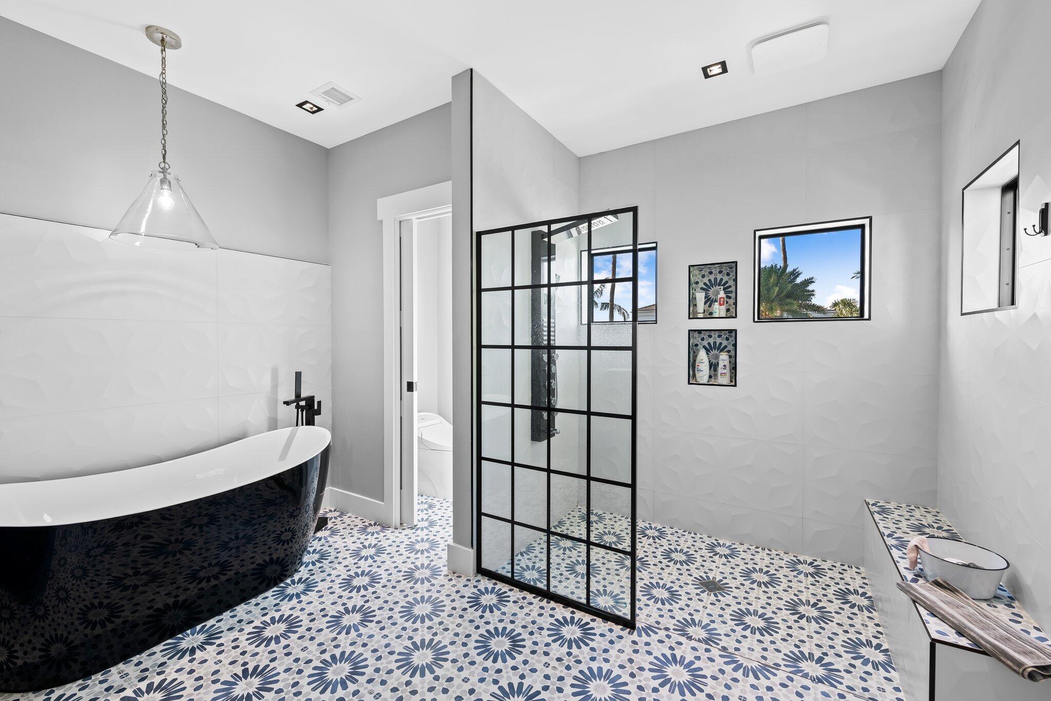 38 Hersey Drive Ocean Ridge, FL 33435 - Photo 23 of 33 a hallway with a black white checkered floor