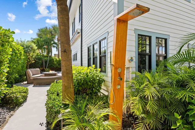 a view of a chairs and table in patio