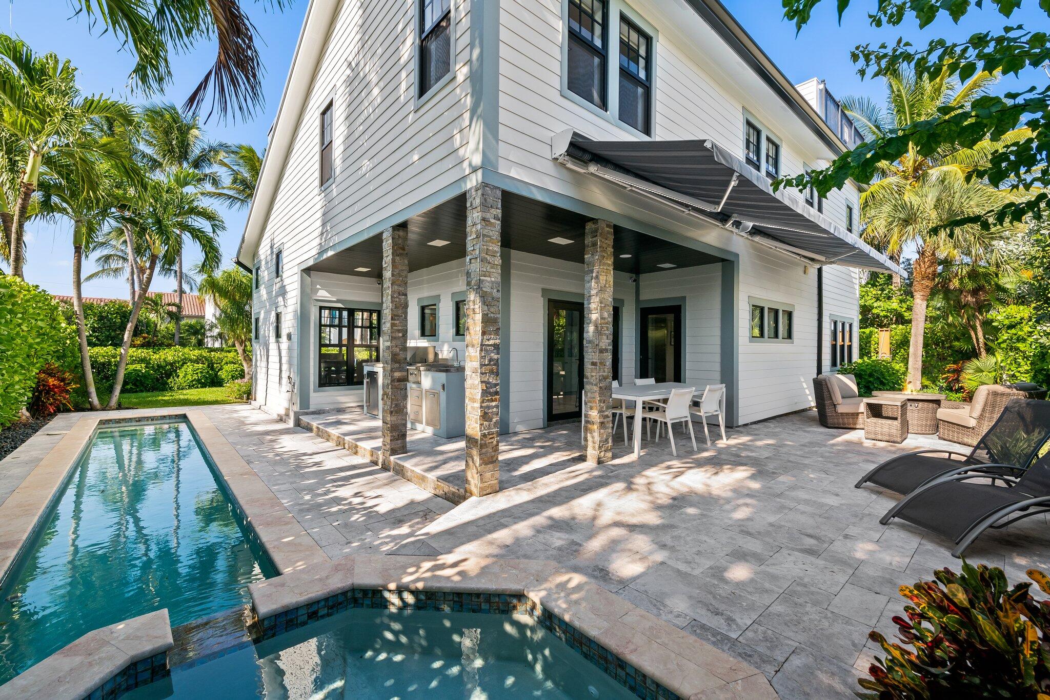 38 Hersey Drive Ocean Ridge, FL 33435 - Photo 6 of 33 a view of a house with backyard porch and sitting area