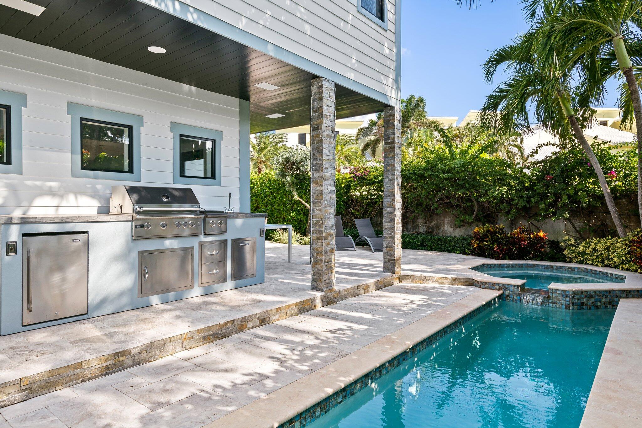 38 Hersey Drive Ocean Ridge, FL 33435 - Photo 10 of 33 a view of a patio with a table chairs and a patio