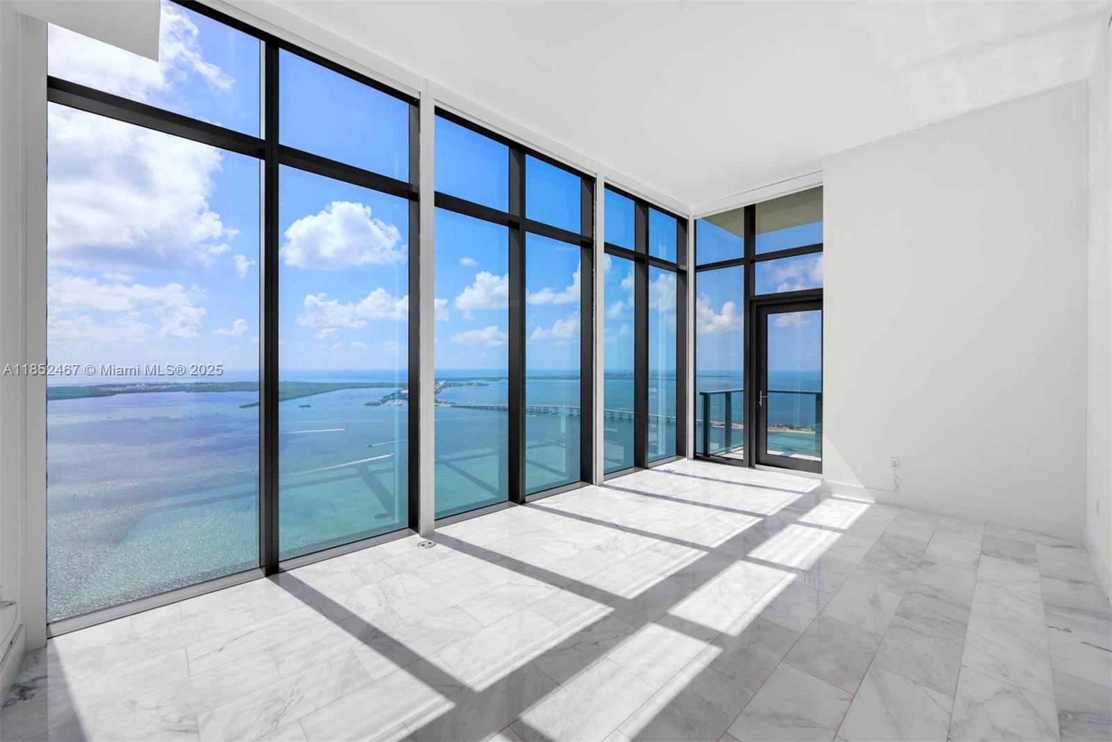 1451 Brickell Avenue, Unit 5302 Miami, FL 33131 - Photo 17 of 25 a large bedroom with a balcony