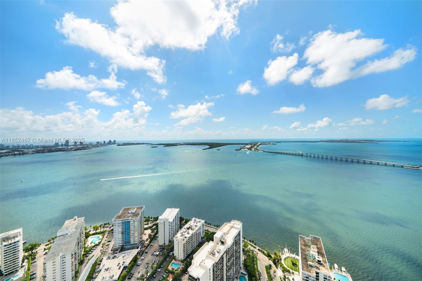 1451 Brickell Avenue, Unit 5302 Miami, FL 33131 - Photo 25 of 25 a view of a lake with table and chairs