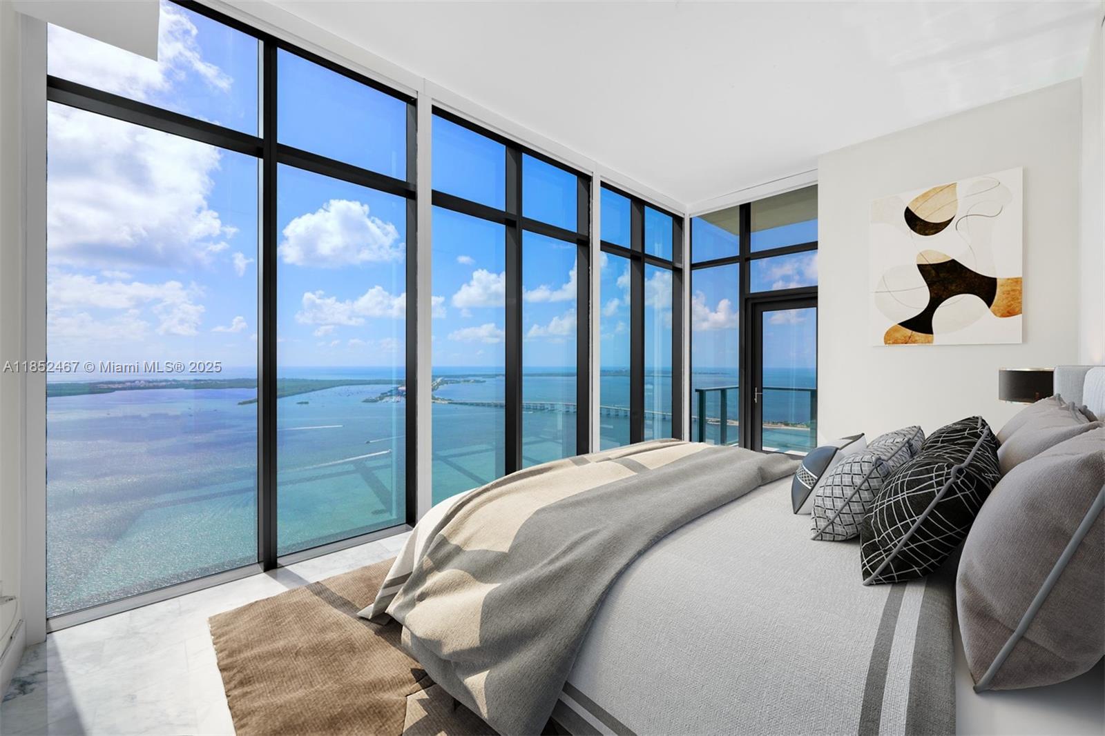 1451 Brickell Avenue, Unit 5302 Miami, FL 33131 - Photo 3 of 25 a bedroom with a bed and a large window