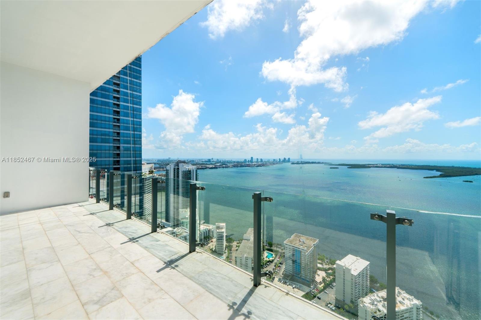 1451 Brickell Avenue, Unit 5302 Miami, FL 33131 - Photo 10 of 25 a terrace with outdoor seating