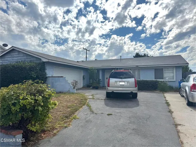 a car parked in front of a house