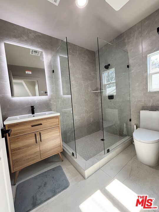 713 Devirian Place Altadena, CA 91001 - Photo 4 of 23 a bathroom with a shower a mirror and a sink