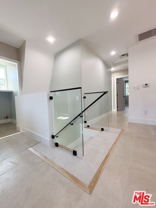 713 Devirian Place Altadena, CA 91001 - Photo 5 of 23 a view of a hallway with a ceiling fan