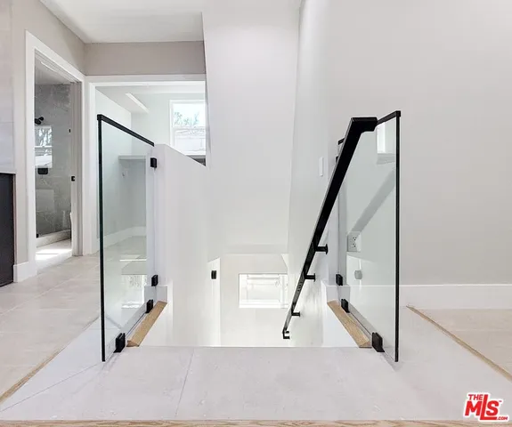 an empty room with a empty space and windows