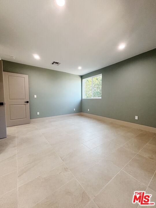 713 Devirian Place Altadena, CA 91001 - Photo 7 of 23 an empty room with a empty space and windows
