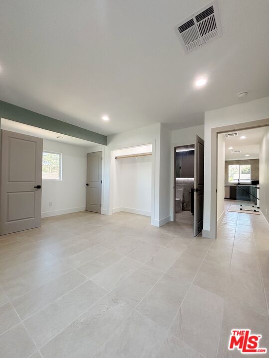 713 Devirian Place Altadena, CA 91001 - Photo 8 of 23 an empty room with closet and fire place