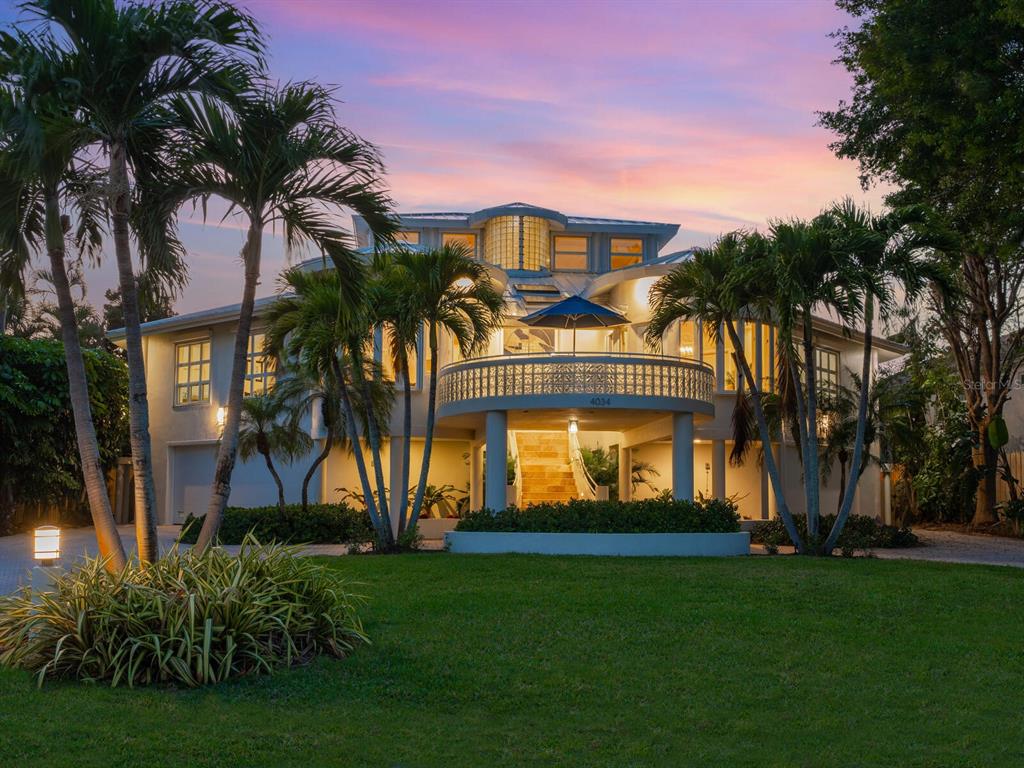 4034 Roberts Point Road Sarasota, FL 34242 - Photo 1 of 1 a front view of a house with a garden