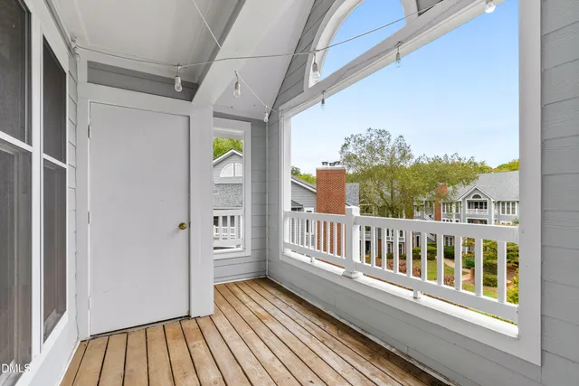 a view of a balcony with wooden floor