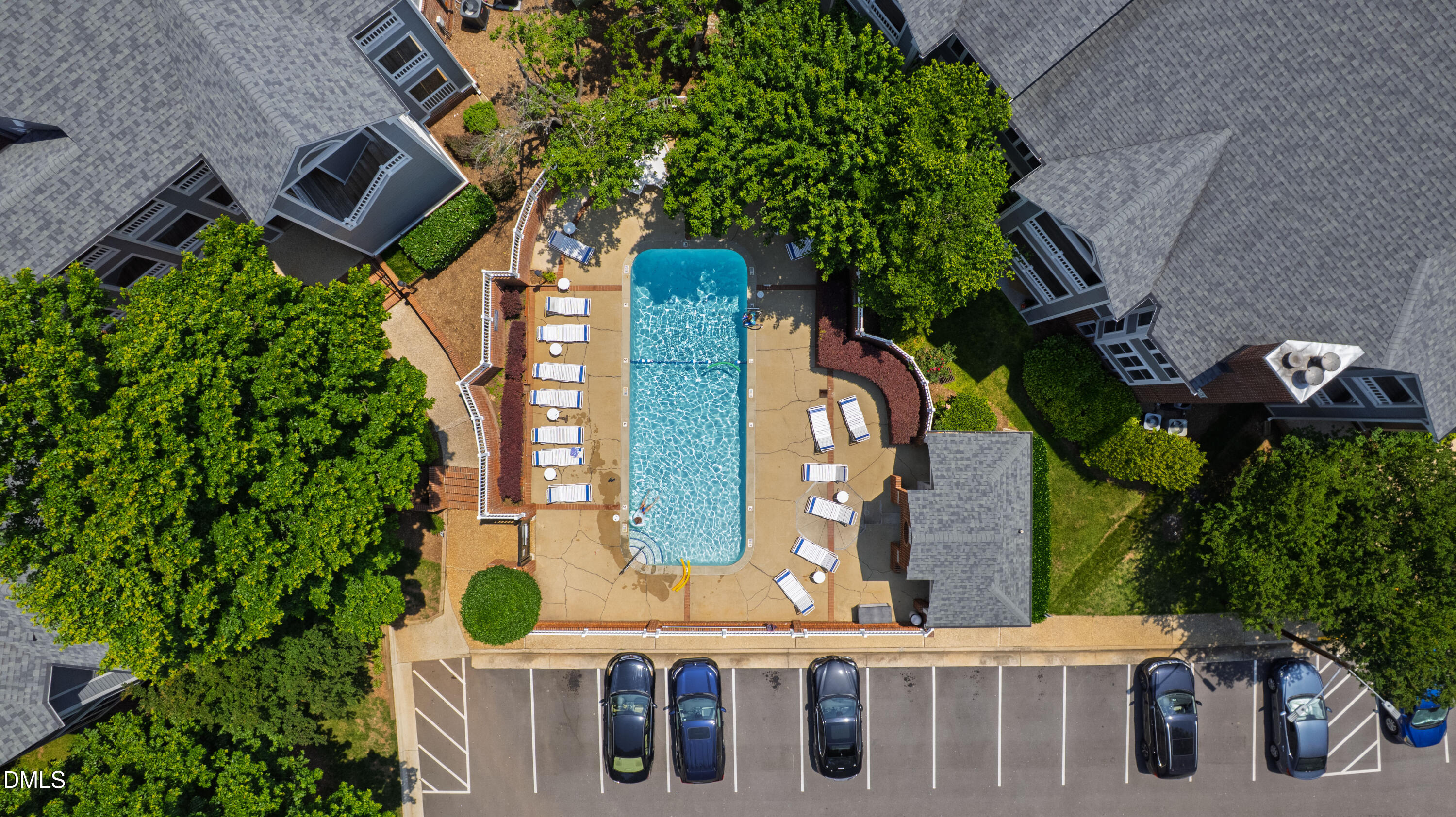 911 Washington Street, Unit 301 Raleigh, NC 27605 - Photo 15 of 22 aerial view of a brick house with plants and large trees
