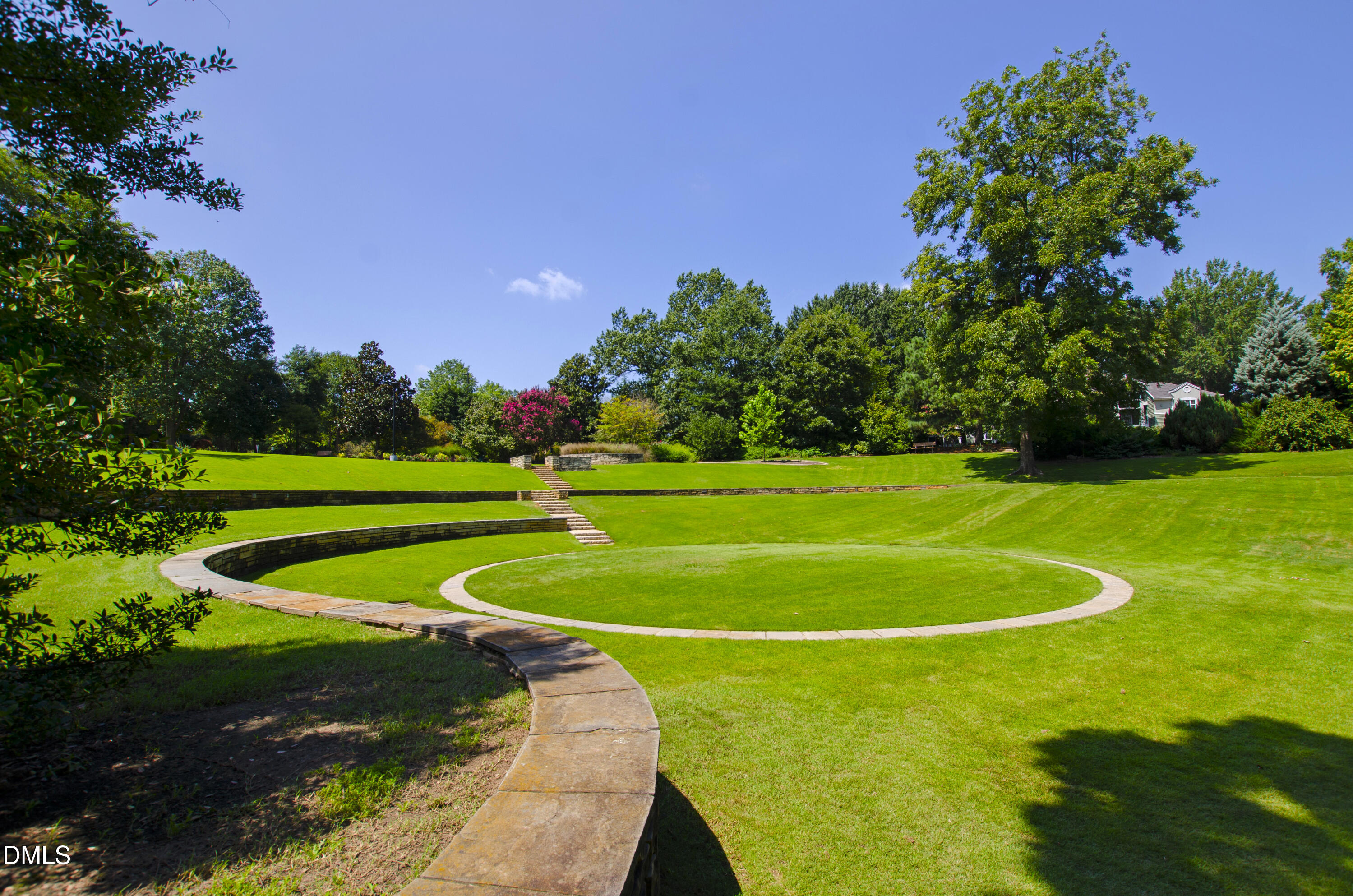 911 Washington Street, Unit 301 Raleigh, NC 27605 - Photo 16 of 22 a view of a tennis ground with a large trees